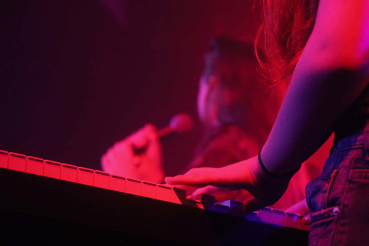 leisure activities woman playing keyboard grand piano